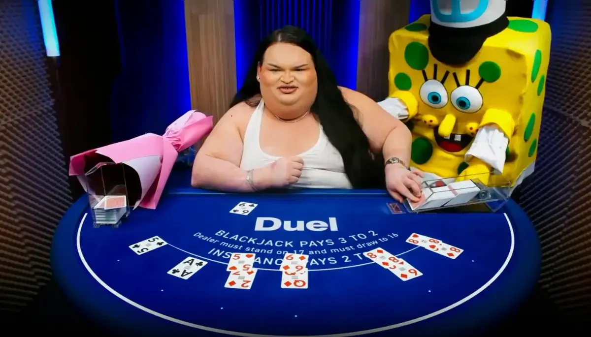 Duel Blackjack Live stream night: dealer at the Duel table joined by a yellow mascot guest